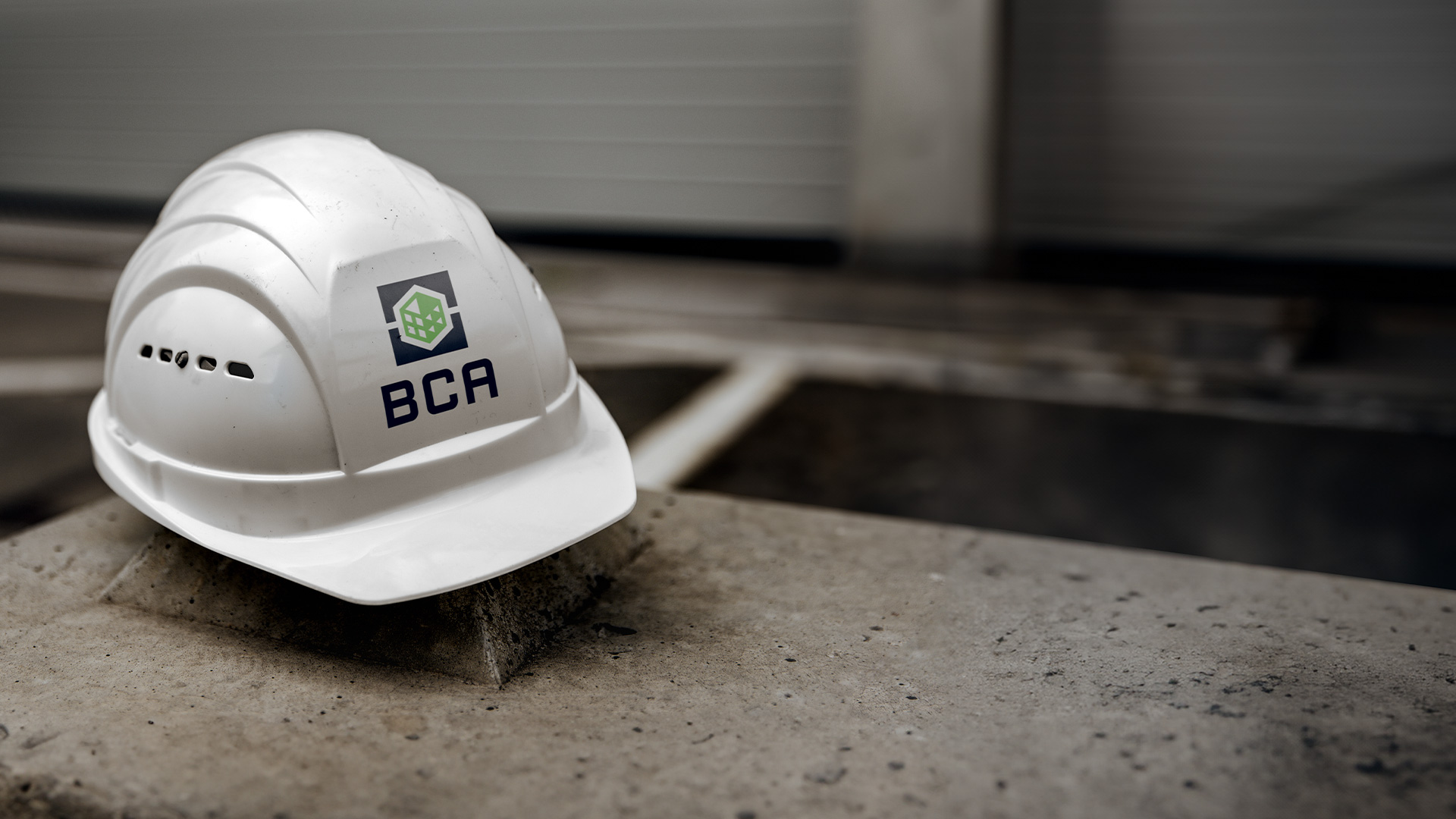 BCA is committed to safety. Photo of a hardhat with a BCA sticker.