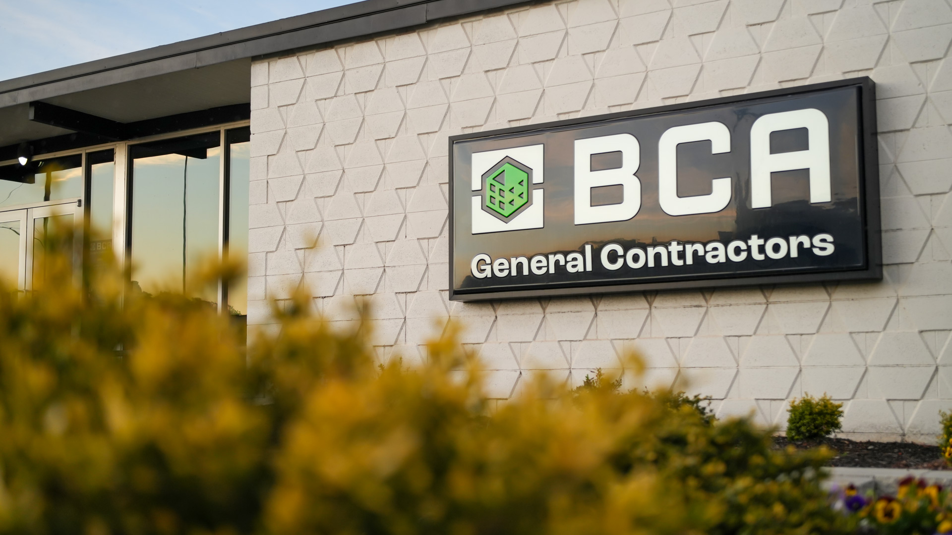 BCA office signage at dusk