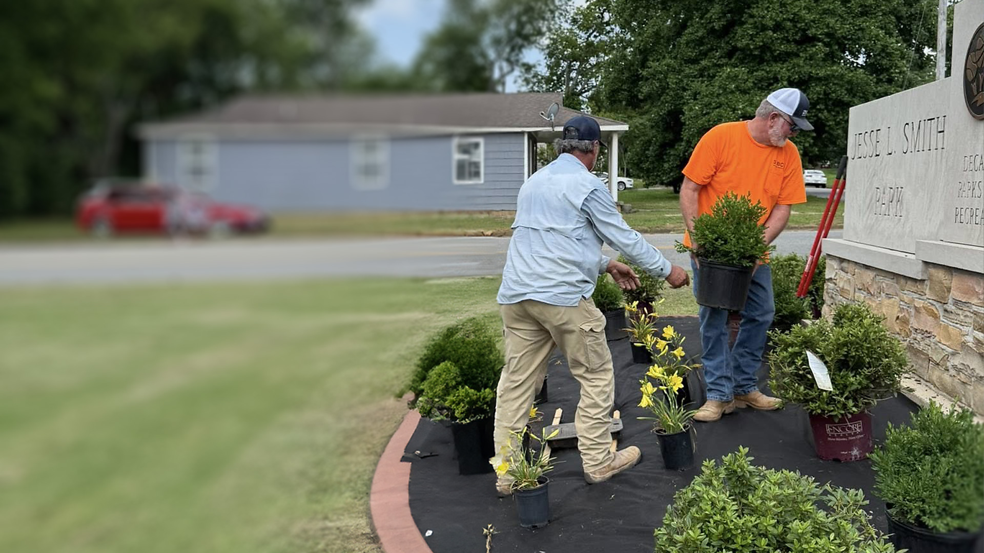 Building Our Community. Photo of BCA employees giving back to the community.
